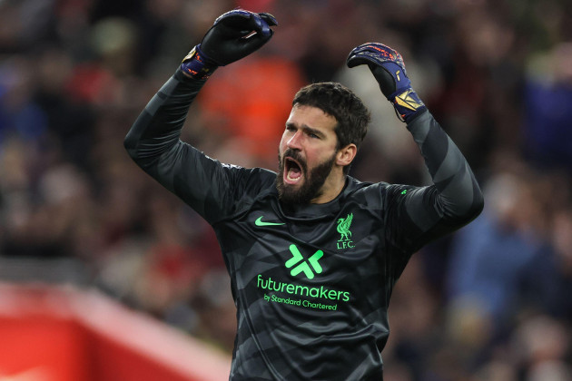 liverpool-uk-17th-dec-2023-alisson-becker-of-liverpool-gees-up-the-crowd-during-the-premier-league-match-liverpool-vs-manchester-united-at-anfield-liverpool-united-kingdom-17th-december-2023-p