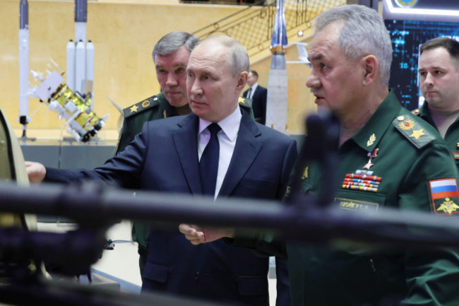 russian-president-vladimir-putin-center-russian-chief-of-general-staff-gen-valery-gerasimov-left-and-russian-defense-minister-sergei-shoigu-right-visit-a-military-exhibition-after-a-meeting-wit