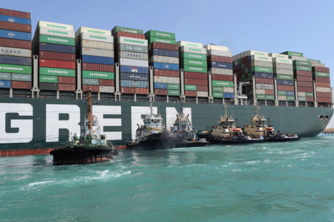 210329-cairo-march-29-2021-xinhua-rescue-vessels-work-at-the-site-of-the-stuck-container-ship-ever-given-on-the-suez-canal-egypt-march-28-2021-the-massive-container-ship-ever-given-has