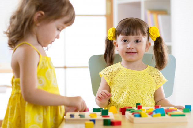 children-learning-to-sort-shapes-in-kindergarten-or-daycare-center