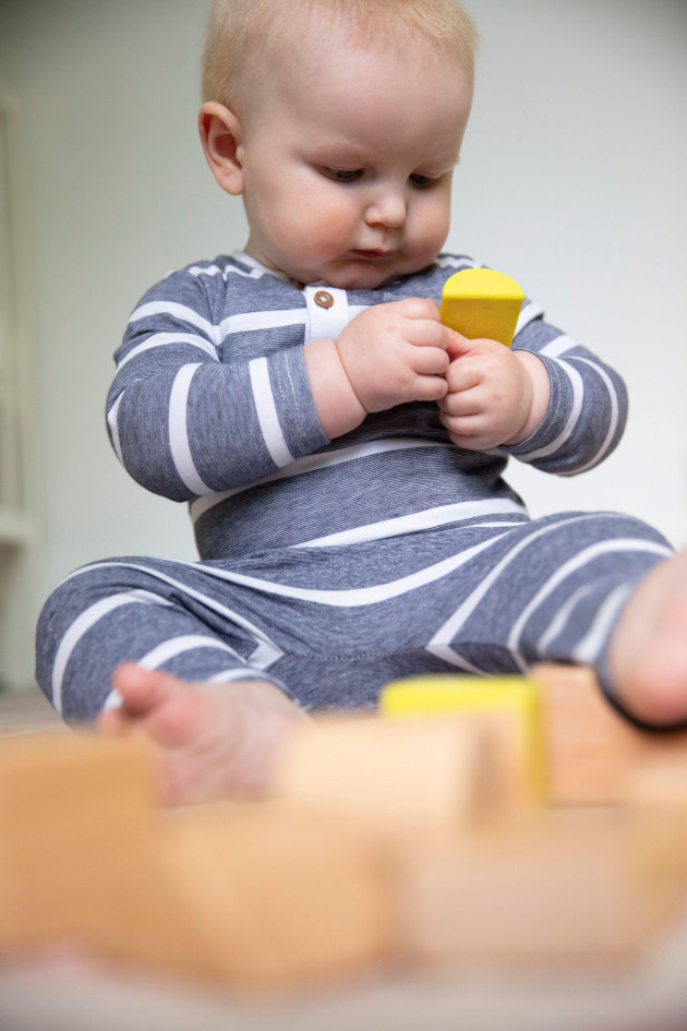 a-cute-little-baby-boy-playing-with-wooden-blocks-baby-learning-and-development
