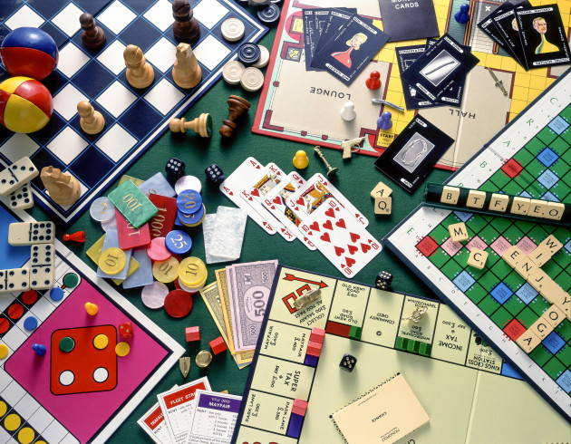 still-life-selection-of-board-games-monopoly-chess-cluedo-scrabble-with-playing-cards-and-gambling-chips