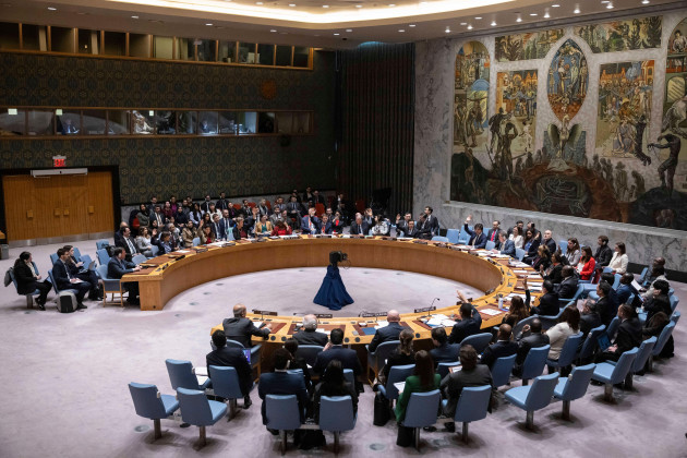 representatives-of-member-countries-take-vote-during-the-security-council-meeting-at-united-nations-headquarters-friday-dec-22-2023-after-many-delays-the-u-n-security-council-adopted-a-watered