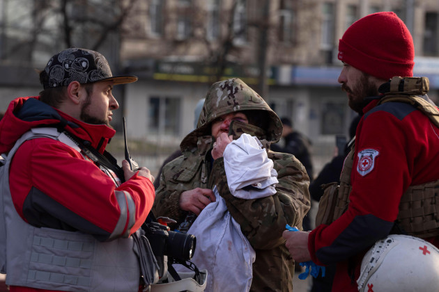 a-wounded-resident-talks-with-paramedics-after-russias-missile-attack-in-kyiv-ukraine-friday-dec-29-2023-russia-launched-about-110-missiles-as-well-as-drones-against-ukrainian-targets-during-th