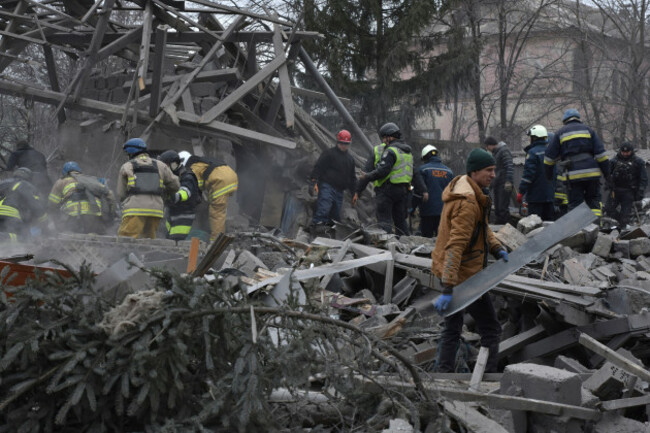 people-clear-the-debris-at-the-site-of-russias-air-attack-in-zaporizhzhia-ukraine-friday-dec-29-2023-russia-launched-missiles-as-well-as-drones-against-ukrainian-targets-during-the-night-ukrain