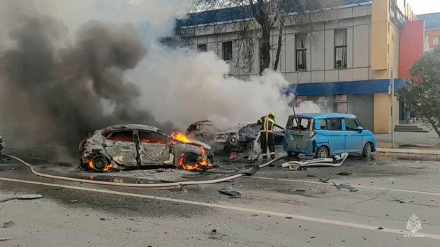 in-this-photo-taken-from-video-released-by-russia-emergency-situations-ministry-telegram-channel-on-saturday-dec-30-2023-firefighters-extinguish-burning-cars-after-shelling-in-belgorod-russia-ru
