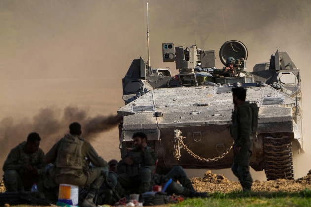 an-israeli-apc-maneuvers-near-the-gaza-strip-border-in-southern-israel-friday-dec-29-2023-the-army-is-battling-palestinian-militants-across-gaza-in-the-war-ignited-by-hamas-oct-7-attack-into-i