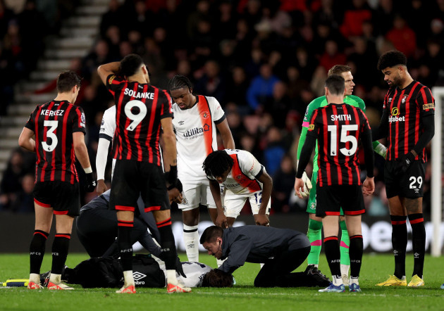 luton-towns-tom-lockyer-receives-treatment-on-the-pitch-during-the-premier-league-match-at-the-vitality-stadium-bournemouth-picture-date-saturday-december-16-2023