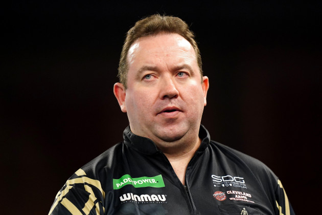 brendan-dolan-in-action-against-luke-littler-not-pictured-on-day-fourteen-of-the-paddy-power-world-darts-championship-at-alexandra-palace-london-picture-date-monday-january-1-2024
