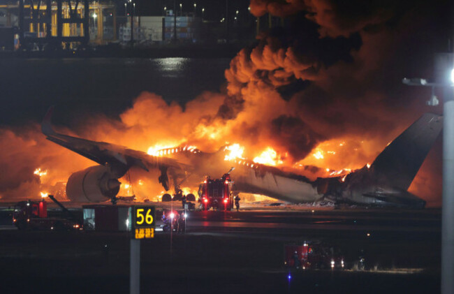 a-japan-airlines-plane-catches-fire-on-the-runway-at-haneda-airport-in-ota-ward-tokyo-on-jan-2nd-2024-firefighting-efforts-are-underway-the-fire-started-on-the-aircraft-just-as-it-landed-haneda-a