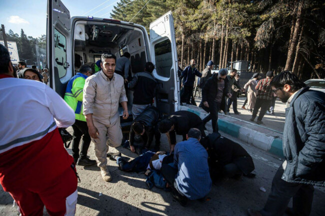 people-take-care-of-injured-after-an-explosion-in-kerman-iran-wednesday-jan-3-2024-explosions-at-an-event-honoring-a-prominent-iranian-general-slain-in-a-u-s-airstrike-in-2020-have-killed-at-le