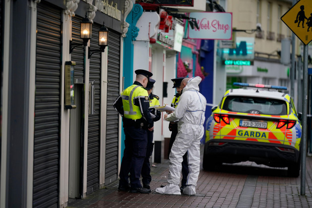 a-forensic-investigator-speaks-to-garda-officers-at-the-scene-in-blanchardstown-dublin-where-a-man-aged-in-his-20s-was-pronounced-dead-after-being-injured-during-a-shooting-incident-at-brownes-stea