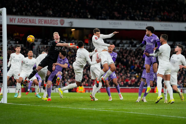 arsenals-jakub-kiwior-center-top-hits-the-ball-to-score-an-own-goal-during-the-english-fa-cup-soccer-match-between-arsenal-and-liverpool-at-emirates-stadium-in-london-sunday-jan-7-2024-ap-pho