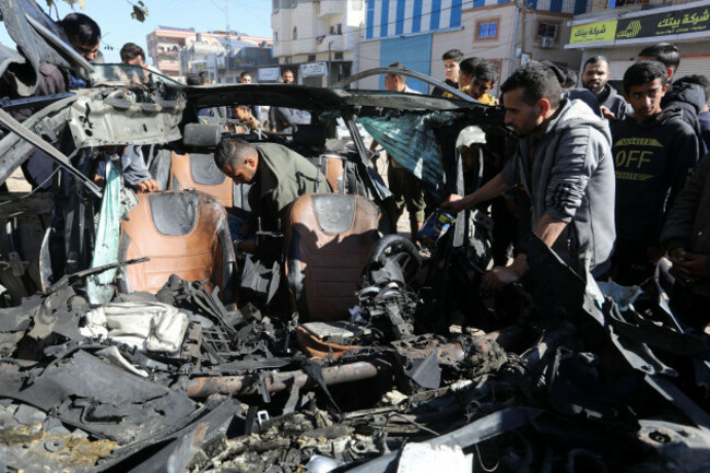 rafah-gaza-07th-jan-2024-palestinians-check-the-car-in-which-two-journalists-mustafa-thuria-a-video-freelancer-for-afp-news-agency-and-hamza-wael-dahdouh-a-journalist-with-al-jazeera-televisio