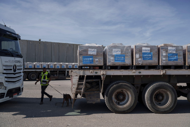 a-border-security-guard-inspects-a-truck-carrying-humanitarian-aid-to-the-gaza-strip-at-the-kerem-shalom-border-crossing-between-israel-and-gaza-southern-israel-monday-jan-8-2024-ap-photoleo-c