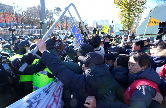 dog-farmers-struggle-with-police-officers-during-a-rally-against-the-government-led-dog-meat-banning-bill-in-front-of-the-presidential-office-in-seoul-south-korea-thursday-nov-30-2023-ap-photo