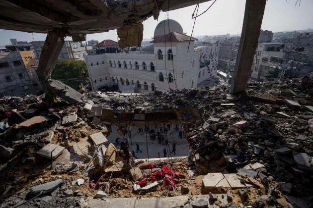 palestinians-look-at-a-damaged-residential-building-after-an-israeli-strike-in-rafah-southern-gaza-strip-wednesday-jan-10-2024-ap-photofatima-shbair