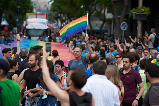 athens-greece-10th-june-2023-people-march-waving-rainbow-flags-and-holding-banners-during-the-athens-pride-anual-parade-thousands-paraded-during-the-athens-pride-2023-parade-to-raise-awareness