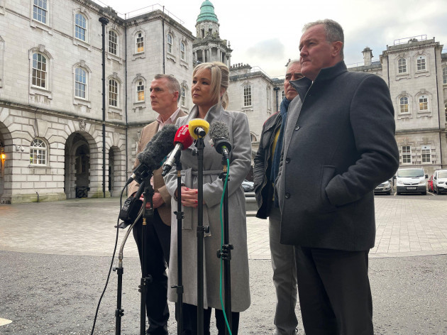 sinn-fein-vice-president-michelle-oneill-speaking-to-the-media-outside-belfast-city-hall-whilst-standing-with-with-sinn-fein-mlas-from-left-declan-kearney-pat-sheehan-and-conor-murphy-ms-oneill