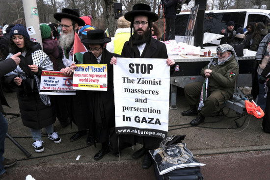 protestors-hold-signs-during-a-demonstration-march-outside-the-international-court-of-justice-in-the-hague-netherlands-thursday-jan-11-2024-the-united-nations-top-court-opens-hearings-thursday