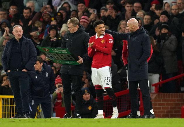 manchester-uniteds-jadon-sancho-with-manager-erik-ten-hag-as-he-comes-off-the-bench-to-make-a-substitute-appearance-during-the-carabao-cup-semi-final-second-leg-match-at-old-trafford-manchester-pi