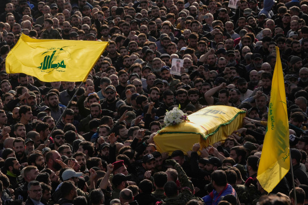 mourners-carry-the-coffin-of-senior-hezbollah-commander-wissam-tawil-during-his-funeral-procession-in-the-village-of-khirbet-selm-south-lebanon-tuesday-jan-9-2024-the-elite-hezbollah-commander-w