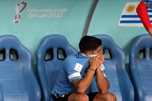 uruguays-luis-suarez-sits-on-the-bench-during-the-world-cup-group-h-soccer-match-between-ghana-and-uruguay-at-the-al-janoub-stadium-in-al-wakrah-qatar-friday-dec-2-2022-ap-photothemba-hadebe