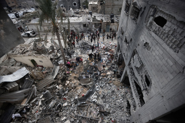 palestinians-look-at-the-destruction-after-an-israeli-strike-in-kahan-younis-gaza-strip-friday-jan-12-2024-ap-photomohammed-dahman