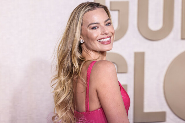 beverly-hills-los-angeles-california-usa-january-07-margot-robbie-wearing-a-giorgio-armani-prive-hot-pink-sequined-gown-and-manolo-blahnik-shoes-arrives-at-the-81st-annual-golden-globe-awards-he