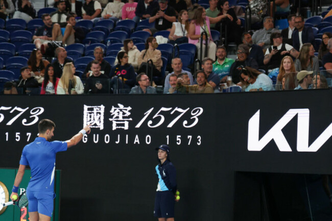 novak-djokovic-of-serbia-points-to-a-spectator-during-his-second-round-match-against-alexei-popyrin-of-australia-at-the-australian-open-tennis-championships-at-melbourne-park-melbourne-australia-we