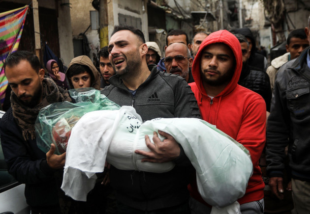 rafah-gaza-16th-jan-2024-the-father-of-masa-shoman-carries-the-body-of-his-daughter-during-her-funeral-in-rafah-on-the-southern-gaza-strip-after-an-israeli-bombardment-on-houses-on-wednesday-ja