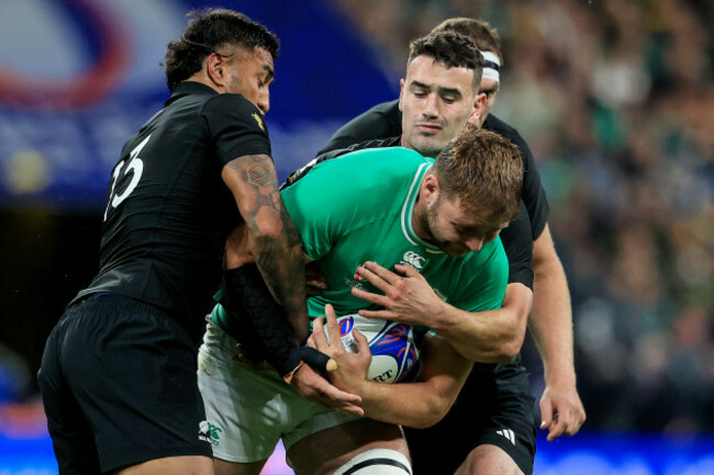 iain-henderson-is-tackled-by-rieko-ioane-and-will-jordan