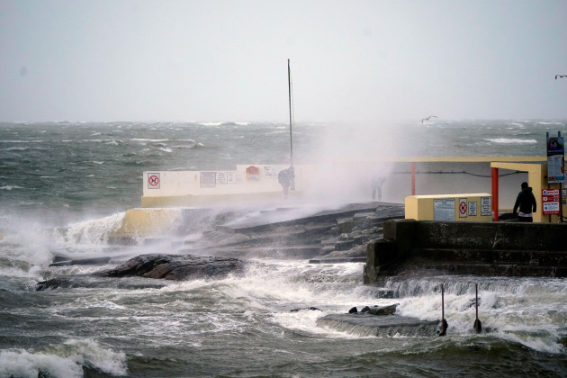 people-taking-photos-of-high-waves-at-salthill-galway-during-storm-isha-with-people-warned-not-to-travel-amid-possible-90mph-gusts-picture-date-sunday-january-21-2024