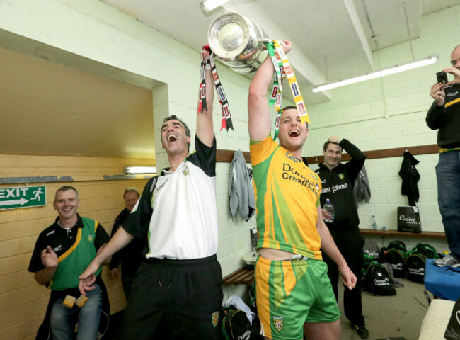 jim-mcguinness-and-michael-murphy-lift-the-anglo-celt-cup-in-the-dresing-room