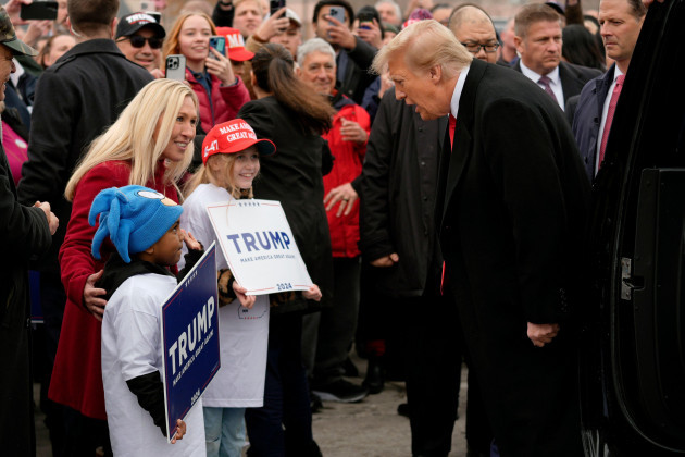 republican-presidential-candidate-former-president-donald-trump-right-and-rep-marjorie-taylor-greene-r-ga-left-greet-young-supporters-at-a-campaign-stop-in-londonderry-n-h-tuesday-jan-23