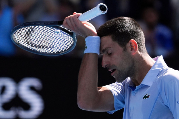 novak-djokovic-of-serbia-wipes-the-sweat-from-his-face-during-his-semifinal-against-jannik-sinner-of-italy-at-the-australian-open-tennis-championships-at-melbourne-park-melbourne-australia-friday