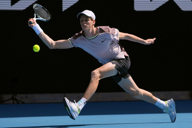 jannik-sinner-of-italy-plays-a-forehand-return-to-novak-djokovic-of-serbia-during-their-semifinal-at-the-australian-open-tennis-championships-at-melbourne-park-melbourne-australia-friday-jan-26