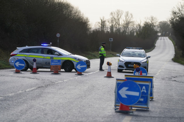a-garda-officer-stands-at-a-roadblock-on-the-n80-at-leagh-on-the-wexford-road-in-co-carlow-where-three-people-have-been-killed-in-a-single-vehicle-accident-on-wednesday-evening-picture-date-thursd