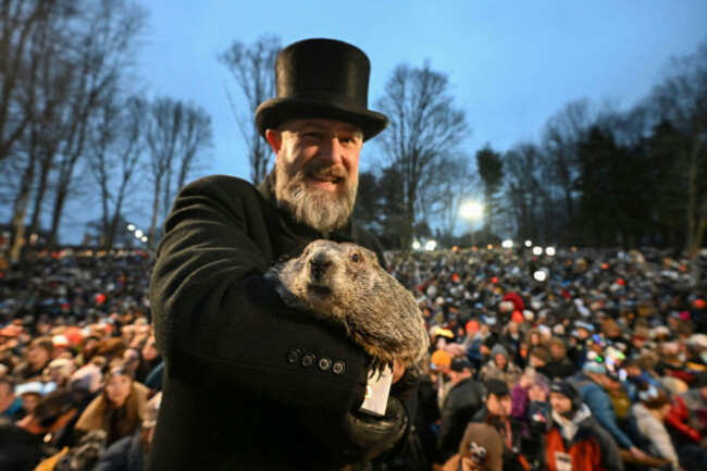 groundhog-club-handler-a-j-dereume-holds-punxsutawney-phil-the-weather-prognosticating-groundhog-during-the-138th-celebration-of-groundhog-day-on-gobblers-knob-in-punxsutawney-pa-friday-feb-2
