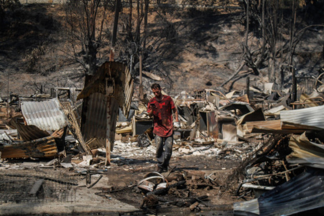 a-person-seen-standing-among-the-rubble-due-to-the-mega-fire-that-occurred-in-the-vina-del-mar-sector-and-surrounding-areas-chile-mega-fire-in-vina-del-mar-and-different-sectors-that-affect-3-000-h