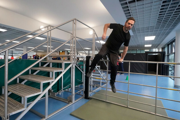 Journalist Darragh Brophy jumps over a farm gate as part of a fitness test during the launch of a recruitment campaign at the Garda Training Center in-templemore-co-tipperary-picture-date-tuesday-fe