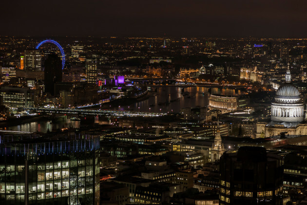 London city skyline at night seen from the air