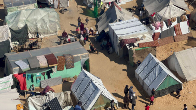 people-sit-near-tents-at-a-make-shift-shelter-for-palestinians-who-fled-to-rafah-people-sit-near-tents-at-a-make-shift-shelter-for-palestinians-who-fled-to-rafah-in-the-southern-gaza-strip-on-february