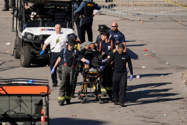 a-person-is-taken-to-an-ambulance-after-an-incident-following-the-kansas-city-chiefs-victory-parade-in-kansas-city-mo-wednesday-feb-14-2024-the-chiefs-defeated-the-san-francisco-49ers-sunday-in