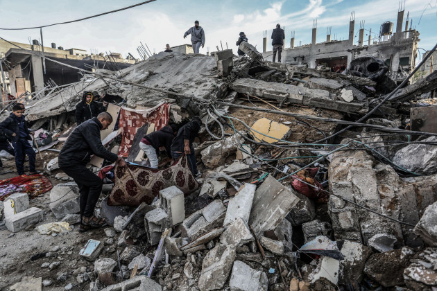 rafah-palestinian-territories-12th-feb-2024-palestinians-inspect-damaged-buildings-after-israeli-airstrikes-on-rafah-southern-gaza-strip-credit-abed-rahim-khatibdpaalamy-live-news
