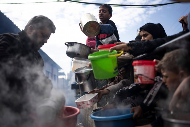 palestinians-line-up-for-a-free-meal-in-rafah-gaza-strip-friday-feb-16-2024-international-aid-agencies-say-gaza-is-suffering-from-shortages-of-food-medicine-and-other-basic-supplies-as-a-result