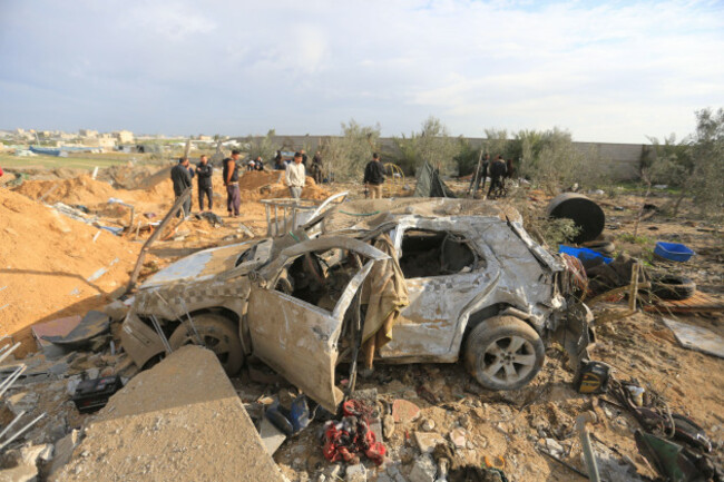 rafah-palestinian-territories-18th-feb-2024-people-look-at-the-aftermath-of-the-israeli-bombardment-on-lands-housing-displaced-palestinians-credit-mohammed-talatenedpaalamy-live-news