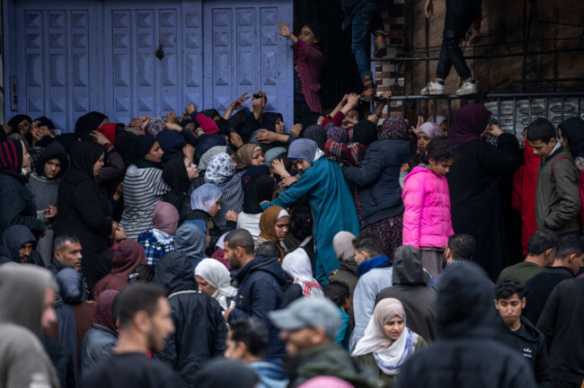 palestinian-crowds-struggle-to-buy-bread-from-a-bakery-in-rafah-gaza-strip-sunday-feb-18-2024-international-aid-agencies-say-gaza-is-suffering-from-shortages-of-food-medicine-and-other-basic-su