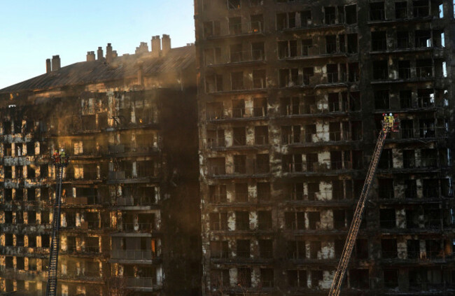 firefighters-work-at-a-burned-block-building-in-valencia-spain-friday-feb-23-2024-a-fire-has-engulfed-two-residential-buildings-in-the-eastern-spanish-city-of-valencia-killing-at-least-four-peo