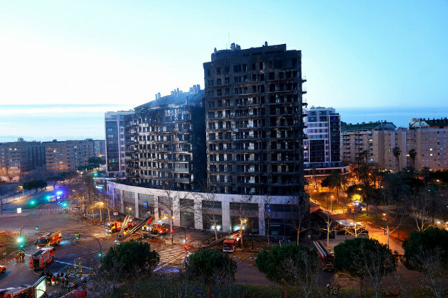 firefighters-work-at-a-burned-block-building-in-valencia-spain-friday-feb-23-2024-a-fire-has-engulfed-two-residential-buildings-in-the-eastern-spanish-city-of-valencia-killing-at-least-four-peo